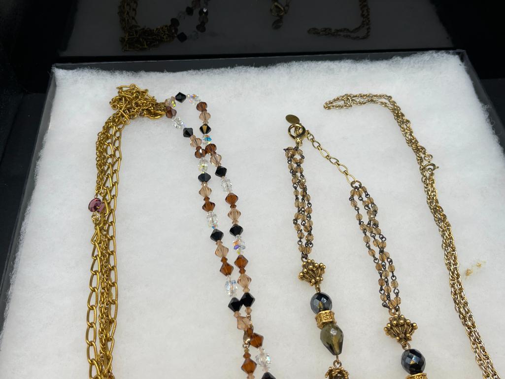 FOUR GOLD TONE STATEMENT NECKLACES INCLUDING THREE VINTAGE, ONE BEADED, AND ONE BY MAYA