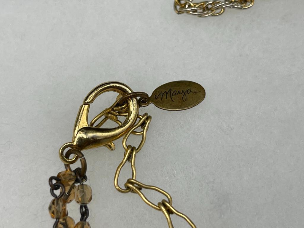 FOUR GOLD TONE STATEMENT NECKLACES INCLUDING THREE VINTAGE, ONE BEADED, AND ONE BY MAYA