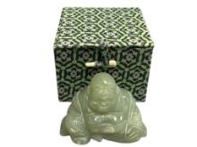 POLISHED GREEN JADE CARVING OF A LAUGHING SEATED BUDDHA