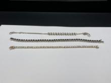 THREE STERLING SILVER FASHION BRACELETS INCLUDING ONE WITH 12 ROUND CUT DIAMONDS