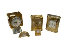 FIVE POLISHED BRASS FINISH DESK / TABLE CLOCKS PLUS CUT GLASS CLOCK