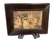 ANTIQUE SEPIA TONED ROMANCE PHOTOGRAPH OF MAN AND WOMAN KISSING OVER A COUCH
