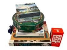 ASSORTED BOARD GAMES AND PUZZLES INCLUDING UPWORDS, YAHTZEE, THOMAS KINKADE PUZZLE, AND MORE