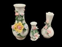 SET OF THREE JAPANESE FIGURAL ROSE BUD VASES