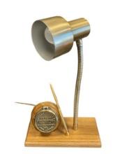 NEPTUNE METER CO. TRIDENT WATER METER FIGURAL OAK AND BRASS DESK LAMP, CLOCK, AND PEN SET