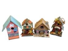 FOUR HOLIDAY THEMED DECORATIVE WOOD BIRDHOUSES INCLUDING CHRISTMAS, THANKSGIVING, AND HALLOWEEN