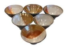 SIX MID-CENTURY COPPER COLORED STONEWARE BOWLS BY ALASKAN ARTIST TAMARA SCHMIDT