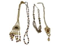 FOUR GOLD TONE STATEMENT NECKLACES INCLUDING THREE VINTAGE, ONE BEADED, AND ONE BY MAYA