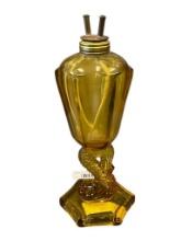 ART DECO PERIOD AMBER GLASS WHALE OIL LAMP WITH DOLPHIN FIGURAL PEDESTAL AND HEXAGONAL BASE