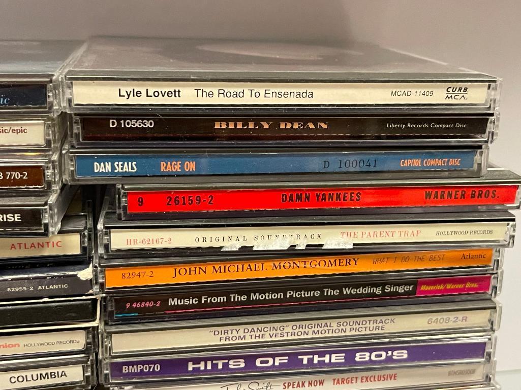 MORE THAN 60 ASSORTED MUSICAL CD'S INCLUDING CHICAGO, LINKIN PARK, BENNY GOODMAN, AND MORE