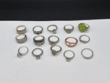 ASSORTED STERLING SILVER FASHION RINGS FEATURING VARIOUS DESIGNS
