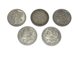 FIVE ASSORTED U.S. MORGAN SILVER DOLLARS