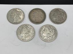 FIVE ASSORTED U.S. MORGAN SILVER DOLLARS