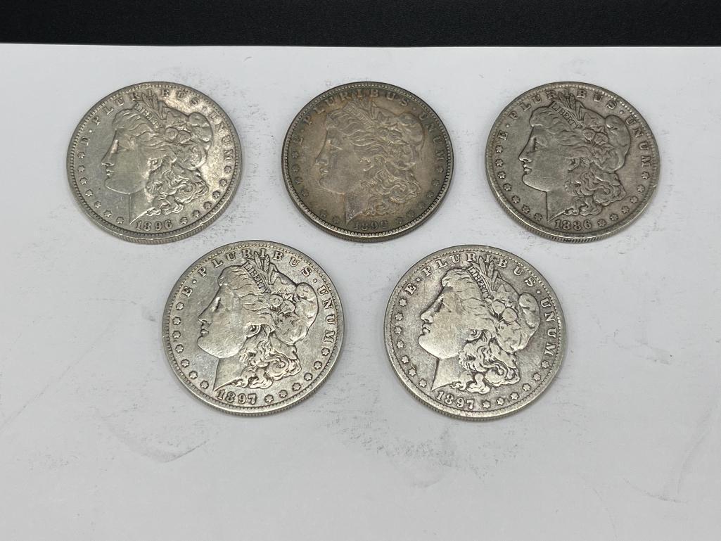 FIVE ASSORTED U.S. MORGAN SILVER DOLLARS