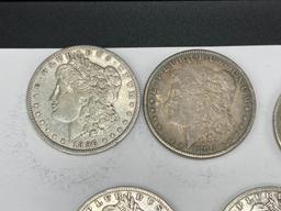 FIVE ASSORTED U.S. MORGAN SILVER DOLLARS