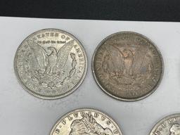 FIVE ASSORTED U.S. MORGAN SILVER DOLLARS