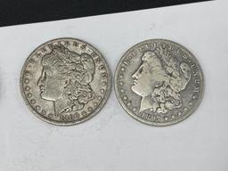 FIVE ASSORTED U.S. MORGAN SILVER DOLLARS