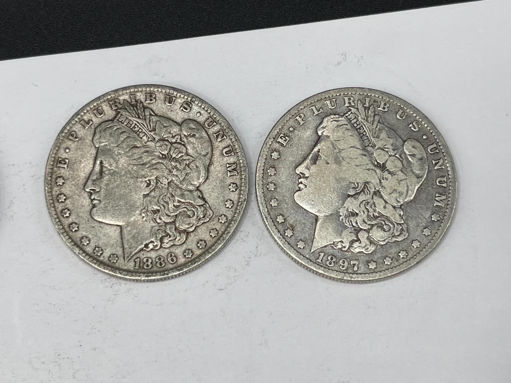 FIVE ASSORTED U.S. MORGAN SILVER DOLLARS