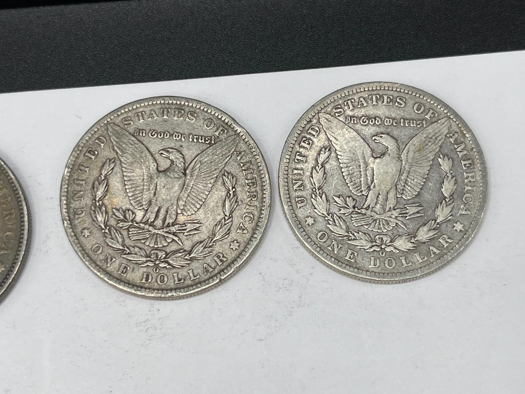 FIVE ASSORTED U.S. MORGAN SILVER DOLLARS