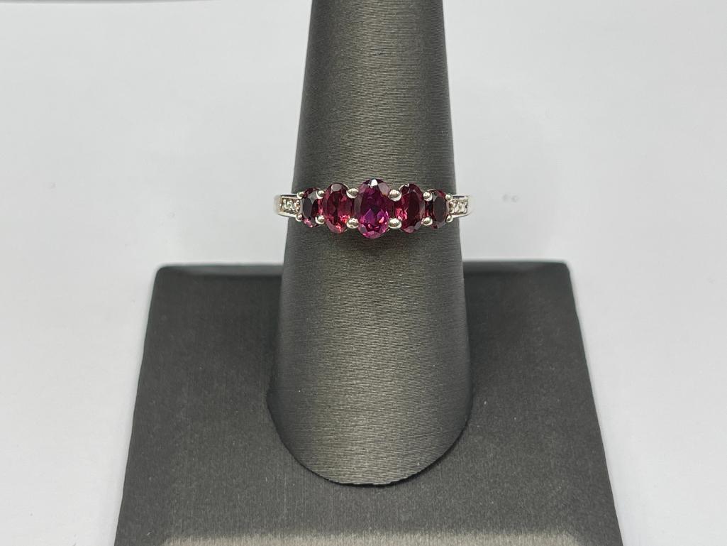 STERLING SILVER RHODOLITE GARNET RING FEATURING FIVE GRADUATED GARNETS