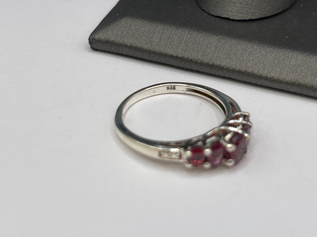 STERLING SILVER RHODOLITE GARNET RING FEATURING FIVE GRADUATED GARNETS