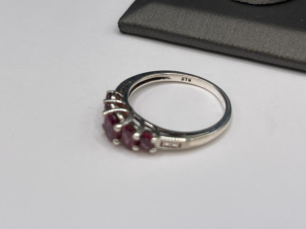 STERLING SILVER RHODOLITE GARNET RING FEATURING FIVE GRADUATED GARNETS
