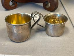 EARLY 20TH CENTURY STERLING SILVER BABY CUPS ONE WITH REPOUSSE FRUIT DESIGN EACH WITH HALLMARK