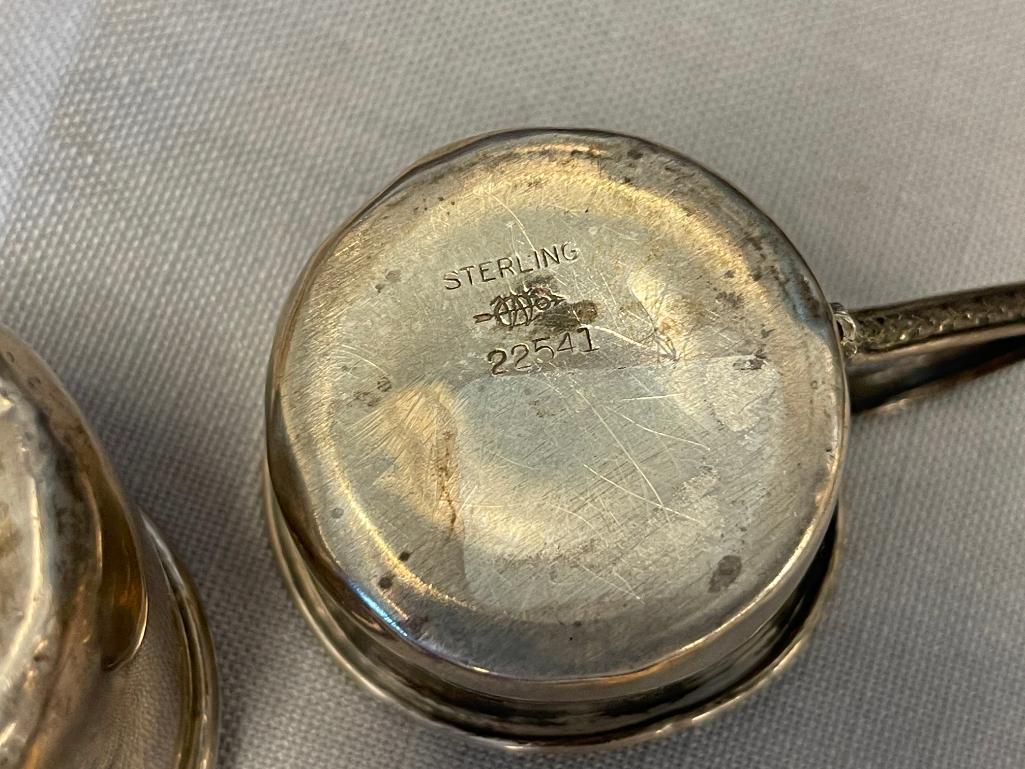 EARLY 20TH CENTURY STERLING SILVER BABY CUPS ONE WITH REPOUSSE FRUIT DESIGN EACH WITH HALLMARK