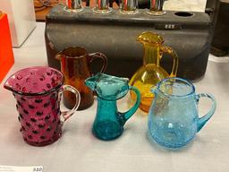 FIVE HAND BLOWN ART GLASS SMALL PITCHERS IN VARIOUS COLORS AND STYLES, RUFFLED RIM, CRACKLED GLASS