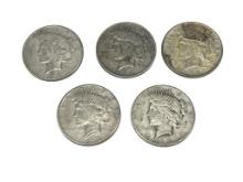 FIVE ASSORTED U.S. PEACE SILVER DOLLARS