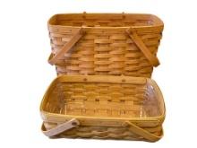 1992 AND 2004 HAND CRAFTEDD LONGABERGER BASKETS BOTH WITH SWIVEL HANDLES DATED AND SIGNED
