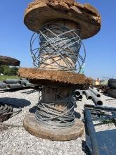 2 wooden wire spools with some wire