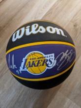 LeBron James and Luka Doncic signed basketball with coa
