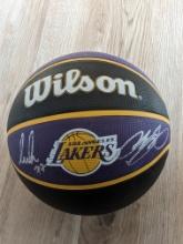 LeBron James and Luka Doncic signed basketball with coa