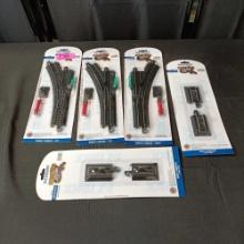 3 packs of remote turnouts and 2 pairs of Hayes bumpers for model train collection