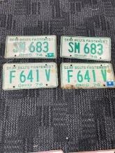 Lot of 4 vintage license plates wall art