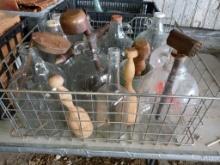 Metal crate with glass jugs and kitchen tools