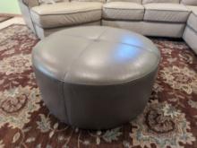 Round Gray Faux Leather Ottoman