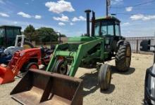 John Deere 4430 tractor in front and loader