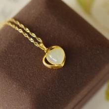An Exquisite Sterling Silver-Gold Plated Inlaid White Jade Pendant