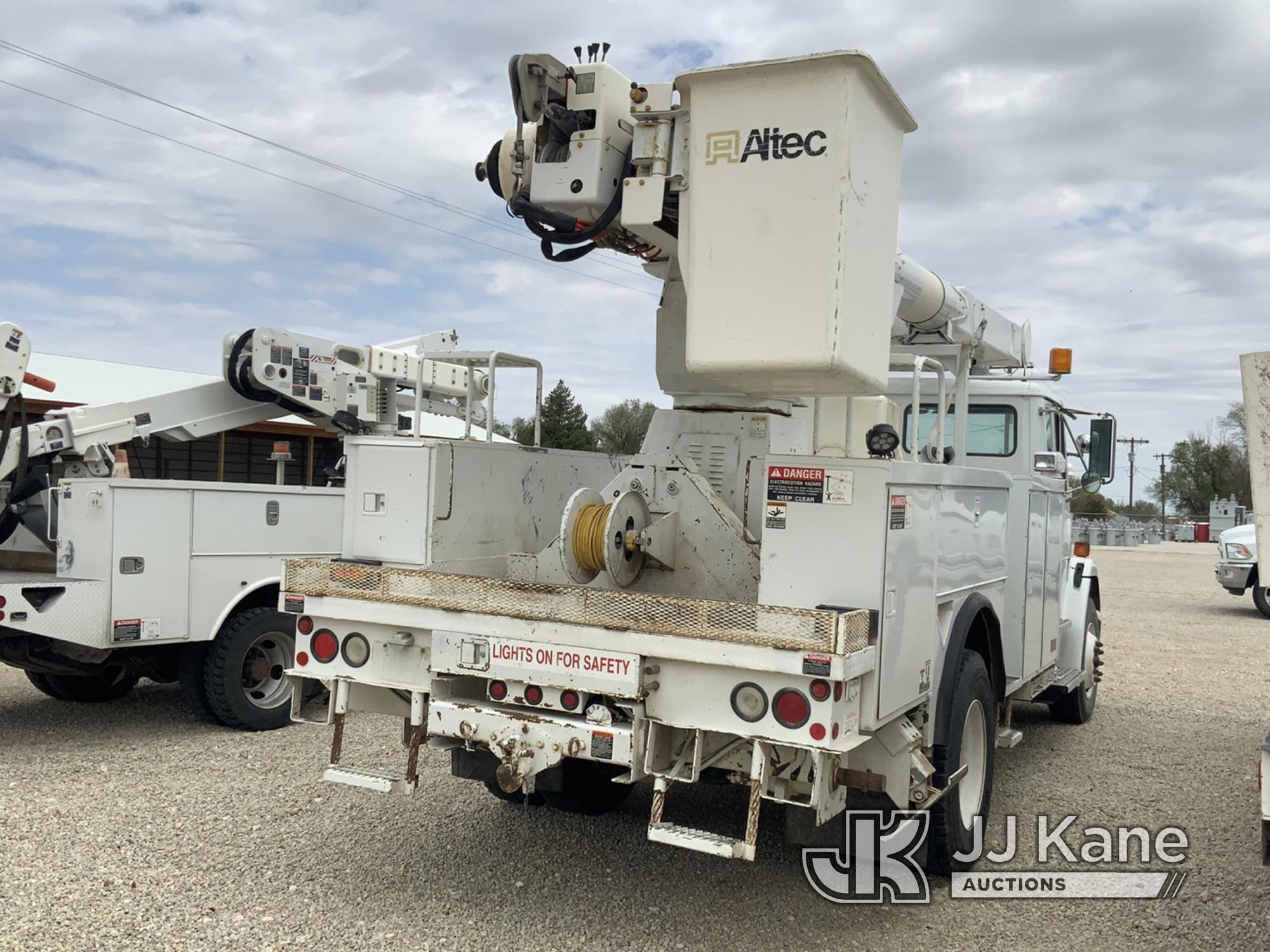 (Dighton, KS) Altec AM855-MH, Over-Center Material Handling Bucket Truck rear mounted on 2000 Freigh