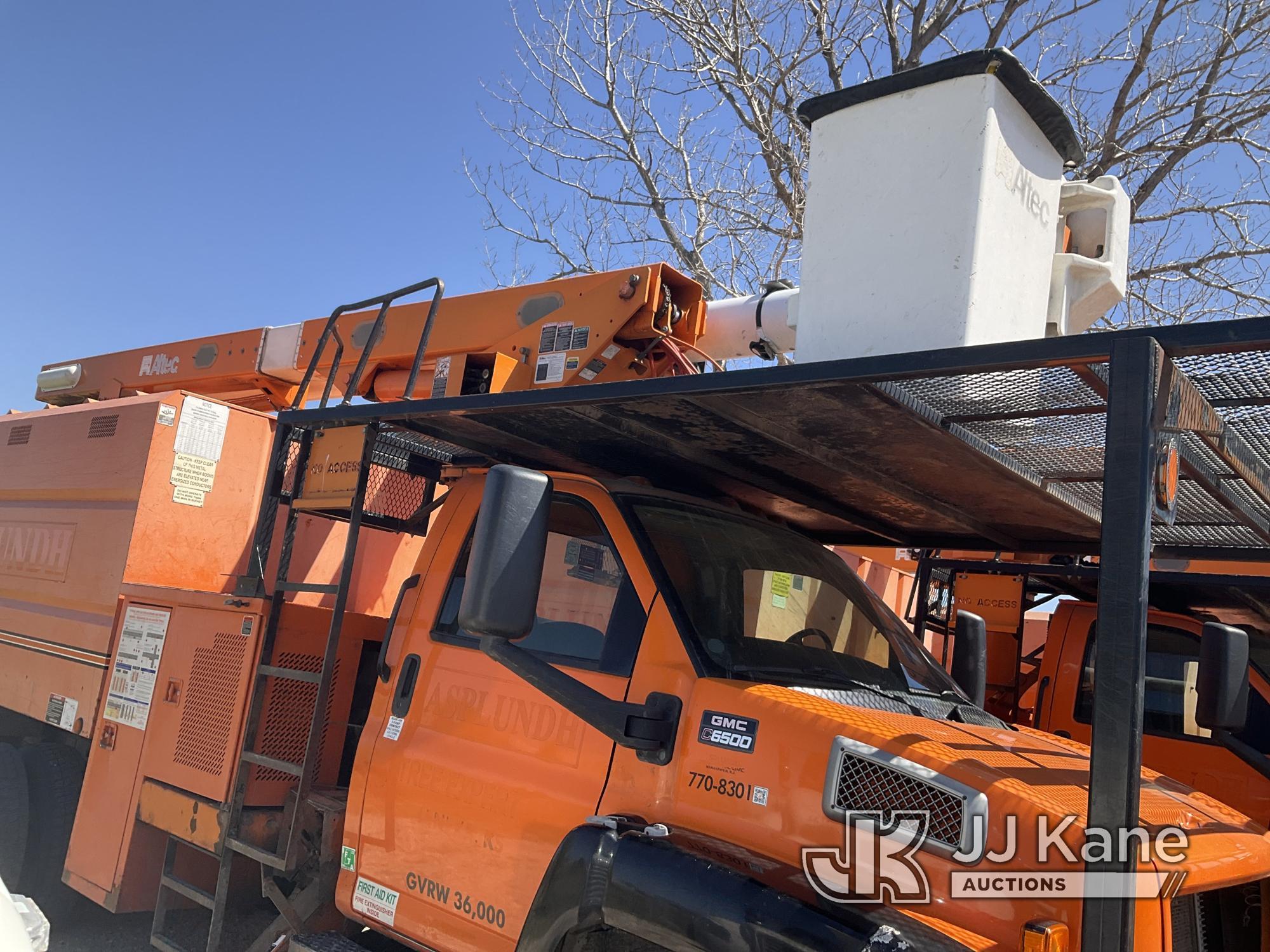 (Kansas City, MO) Altec LRV55, Over-Center Bucket Truck mounted behind cab on 2006 GMC C7500 Chipper