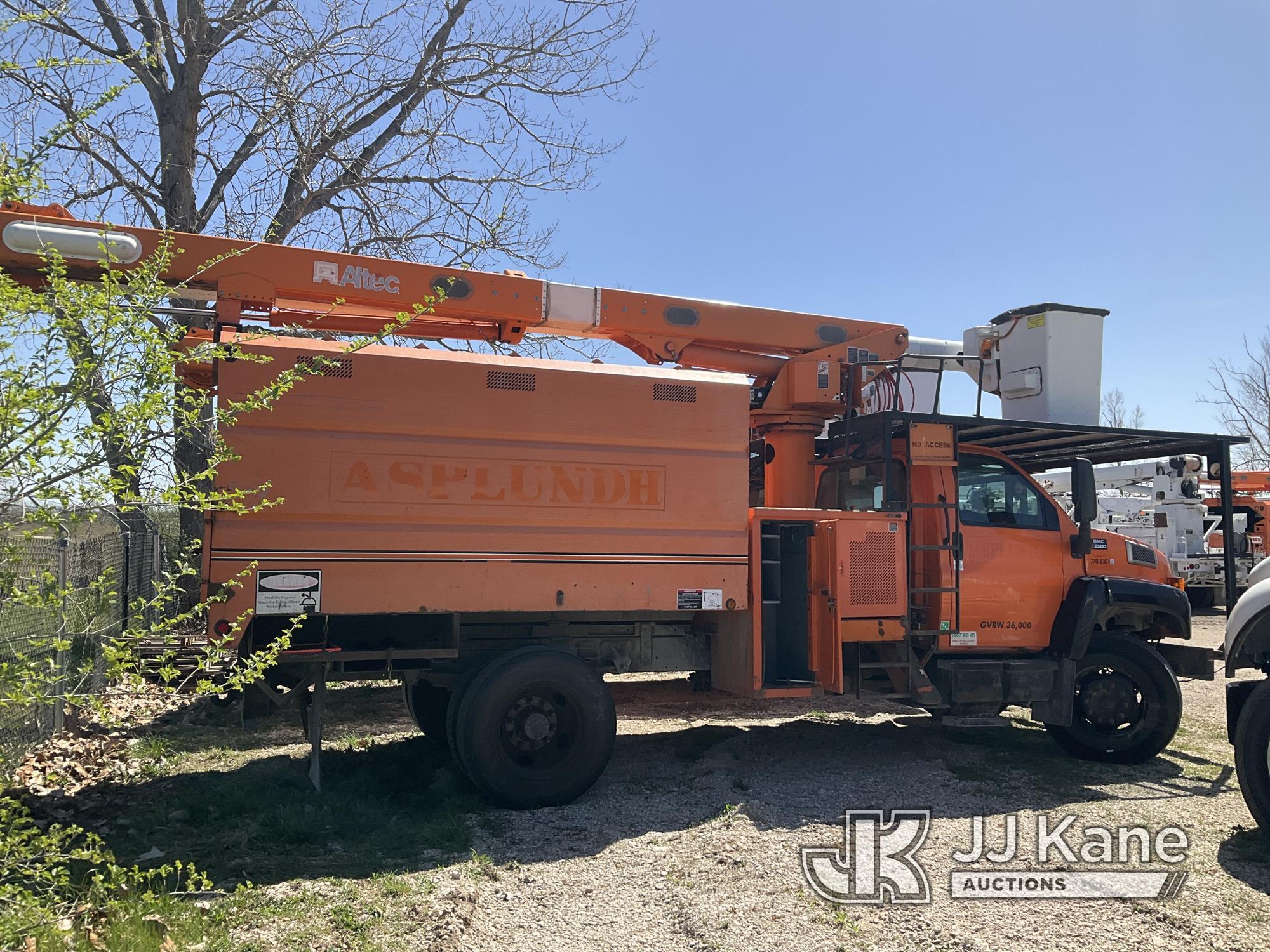 (Kansas City, MO) Altec LRV55, Over-Center Bucket Truck mounted behind cab on 2006 GMC C7500 Chipper