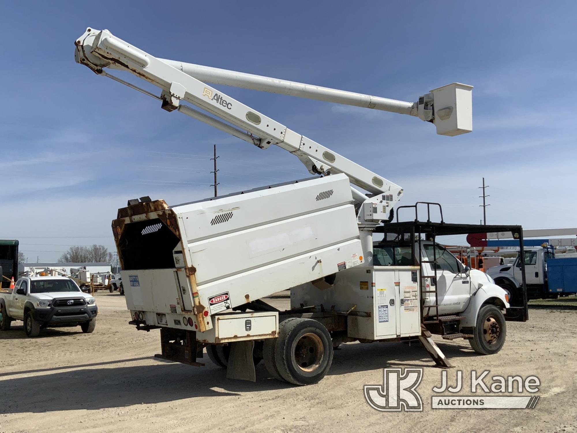 (Charlotte, MI) Altec LRV55, Over-Center Bucket Truck mounted behind cab on 2010 Ford F750 Chipper D