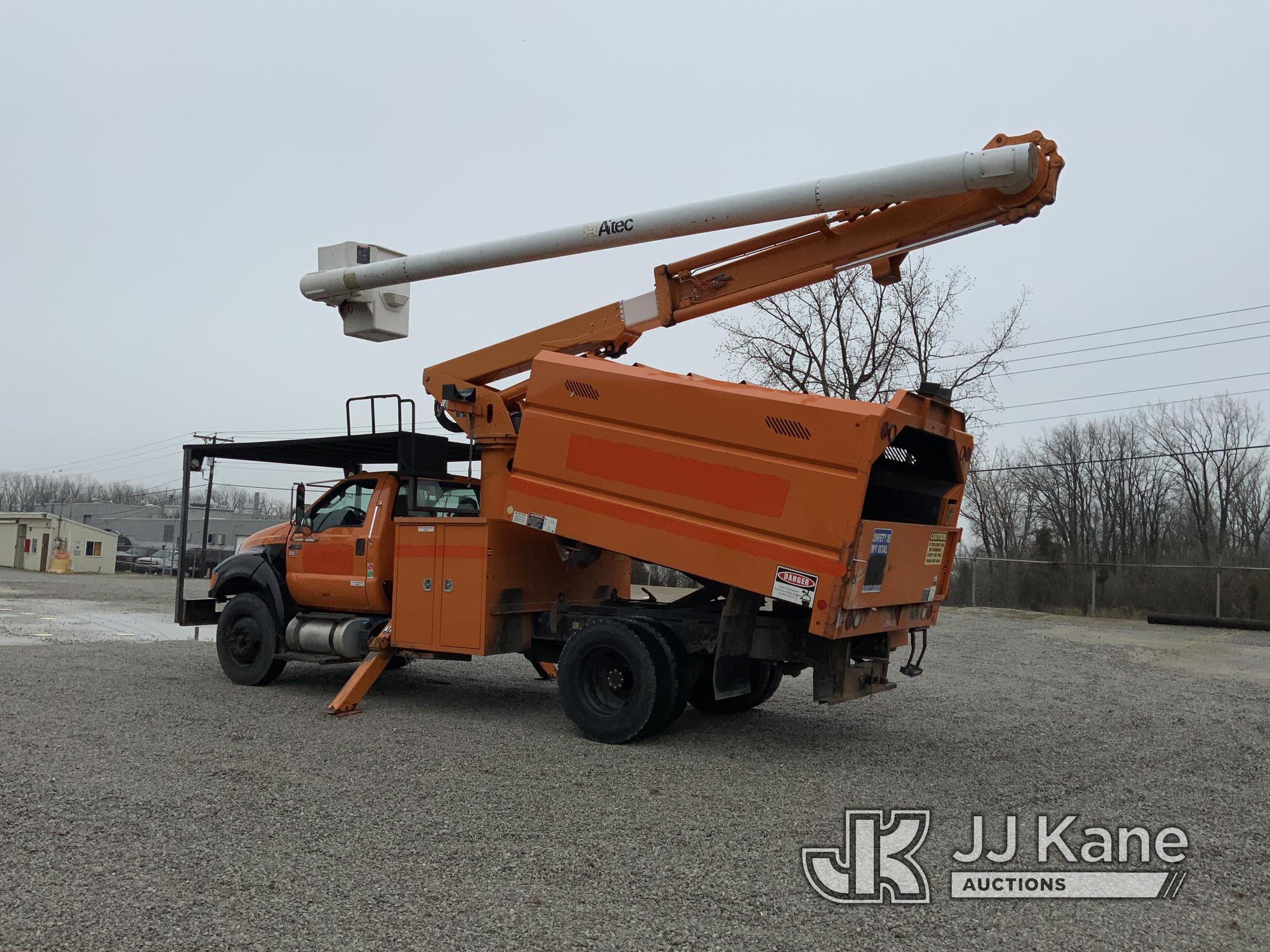 (Fort Wayne, IN) Altec LR756, Over-Center Bucket Truck mounted behind cab on 2013 Ford F750 Chipper