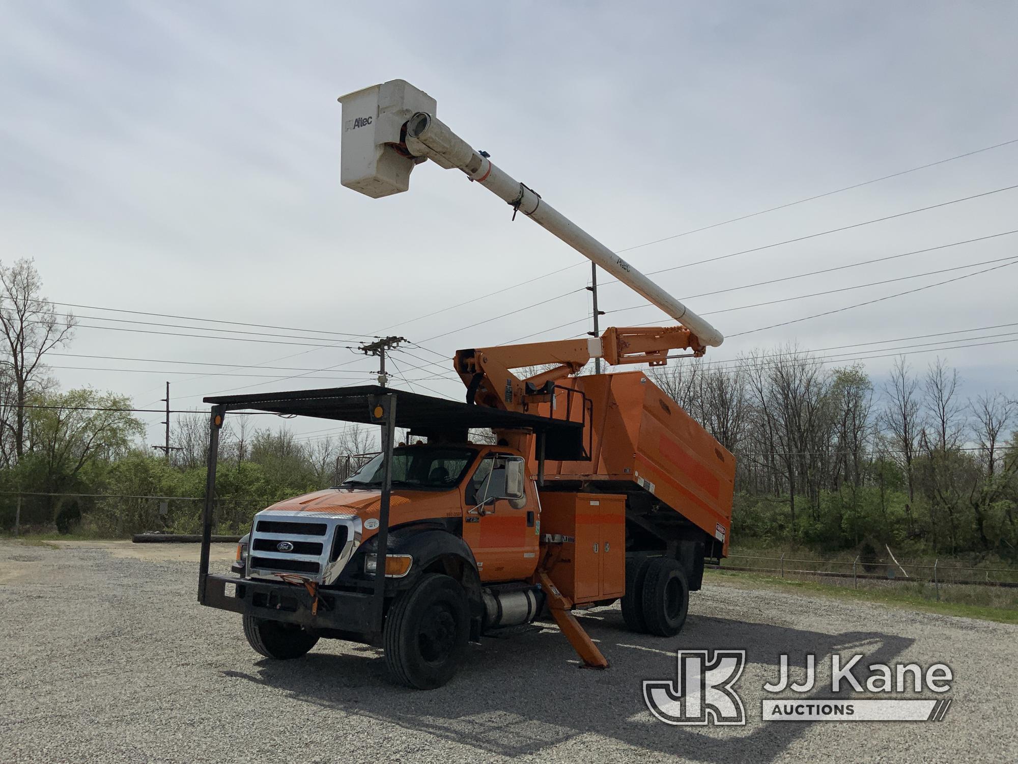 (Fort Wayne, IN) Altec LR756, Over-Center Bucket Truck mounted behind cab on 2013 Ford F750 Chipper