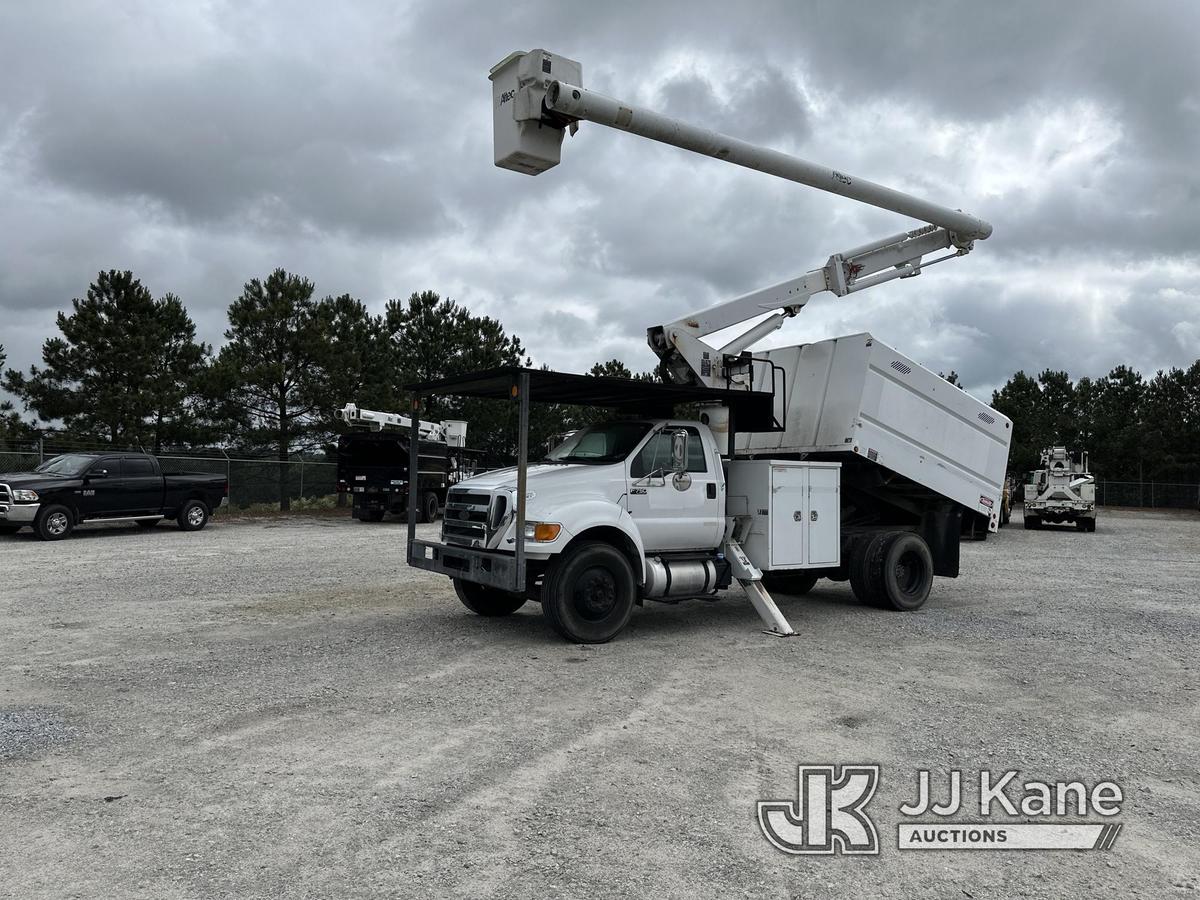 (Villa Rica, GA) Altec LR756, Over-Center Bucket Truck mounted behind cab on 2013 Ford F750 Chipper