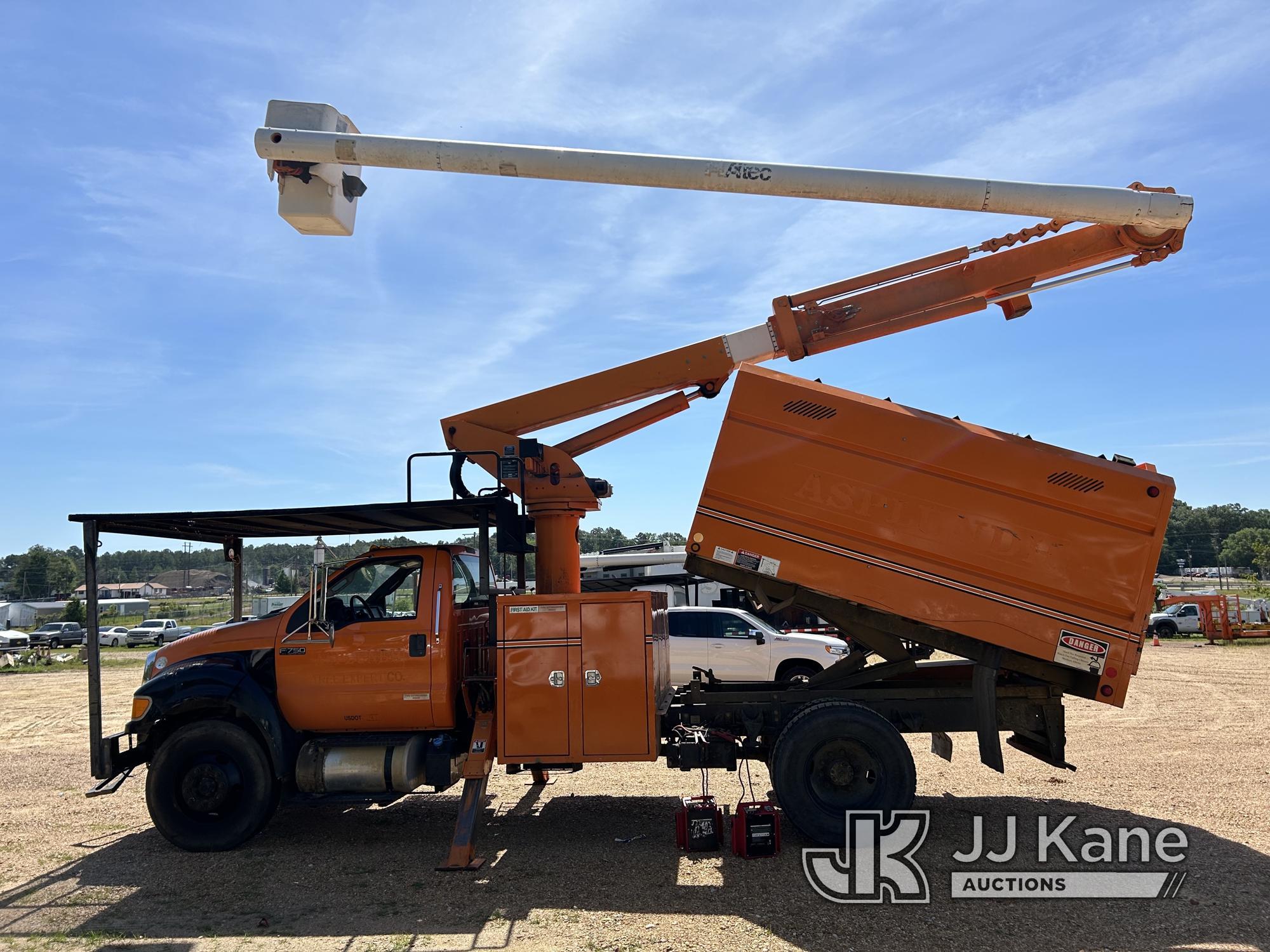 (Byram, MS) Altec LR756, Over-Center Bucket Truck mounted behind cab on 2013 Ford F750 Chipper Dump