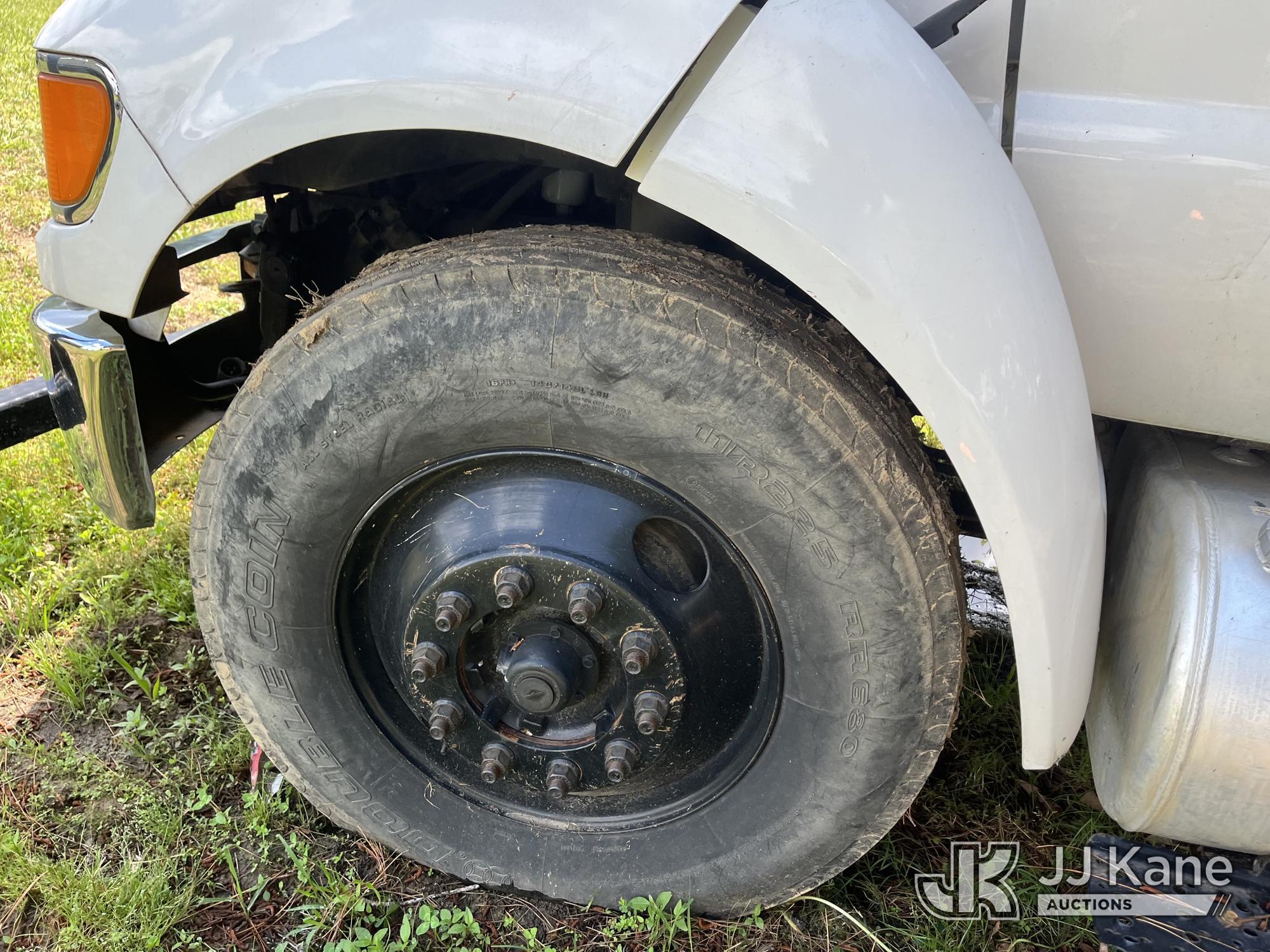 (Wakefield, VA) HiRanger XT55, Over-Center Bucket Truck mounted behind cab on 2013 Ford F750 Chipper
