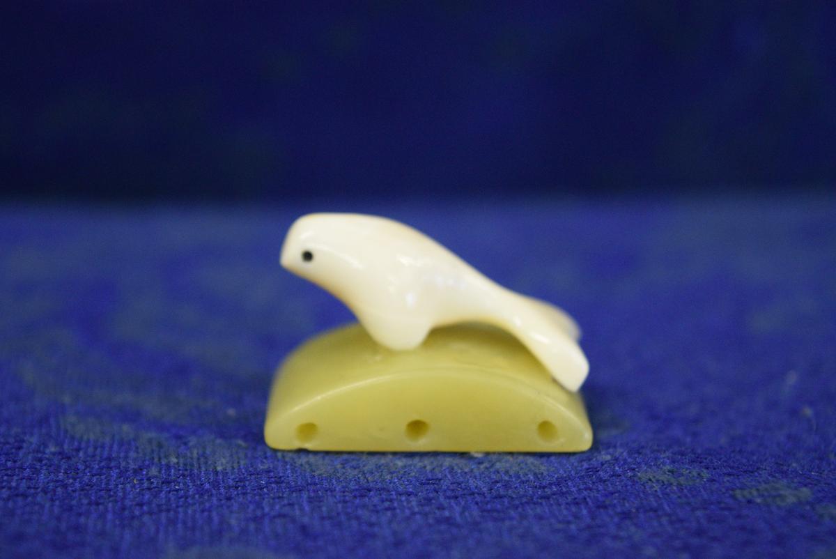 HAND CARVED BONE WHALE ON JADE!